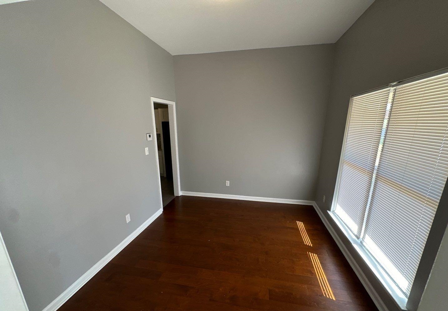 9420 Grove Road Cordova, TN 38016 - Photo 8 of 15 Unfurnished room with dark wood-style flooring and baseboards