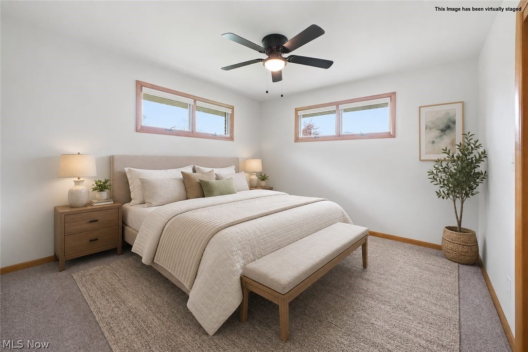 10121 Springfield Road Youngstown, OH 44514 - Photo 23 of 50 bedroom 3 featuring crisp white walls, light wood window trim, a ceiling fan with integrated lighting, and carpeted flooring