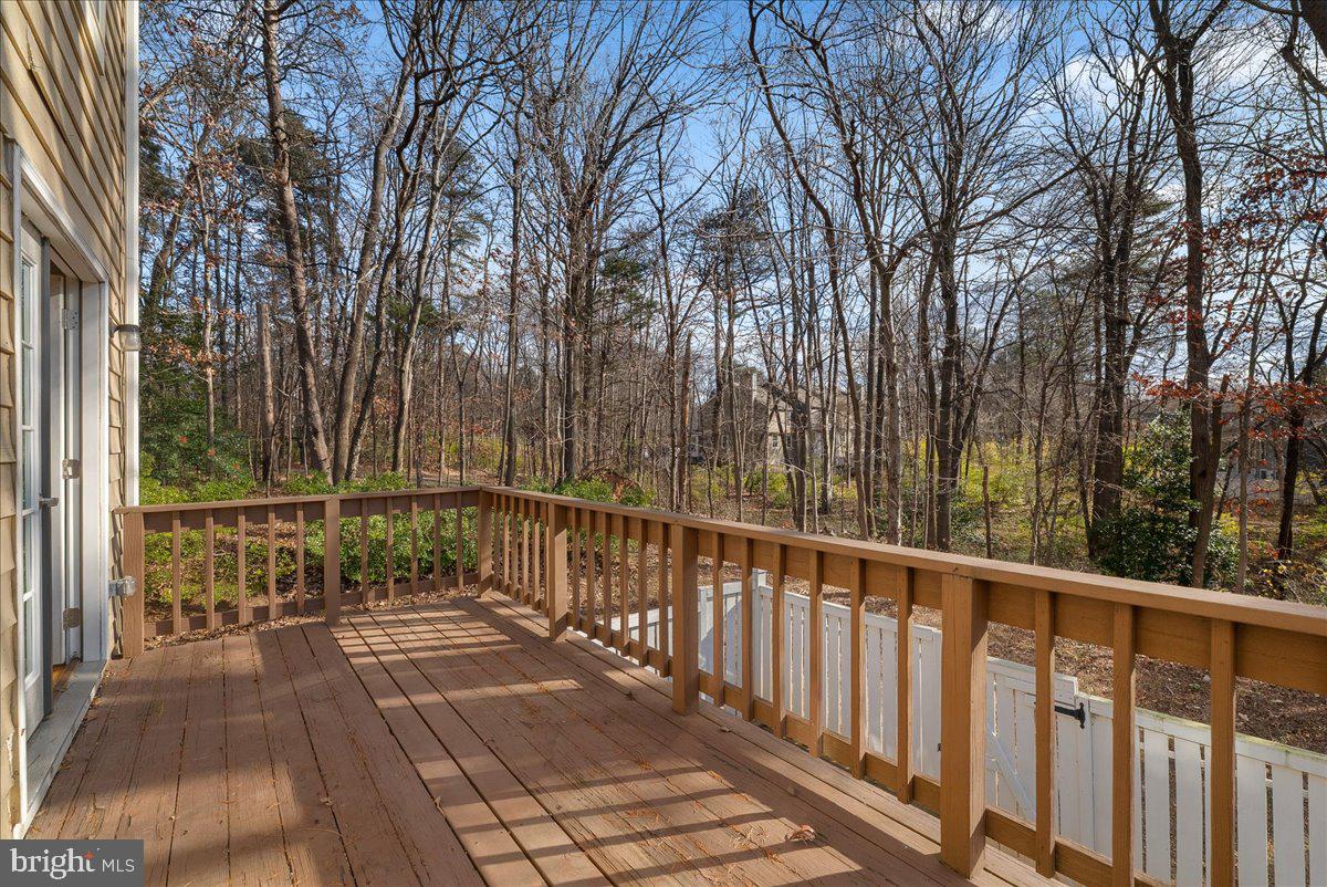 1481 Autumn Ridge Circle Reston, VA 20194 - Photo 14 of 26 a view of a balcony with wooden floor and fence