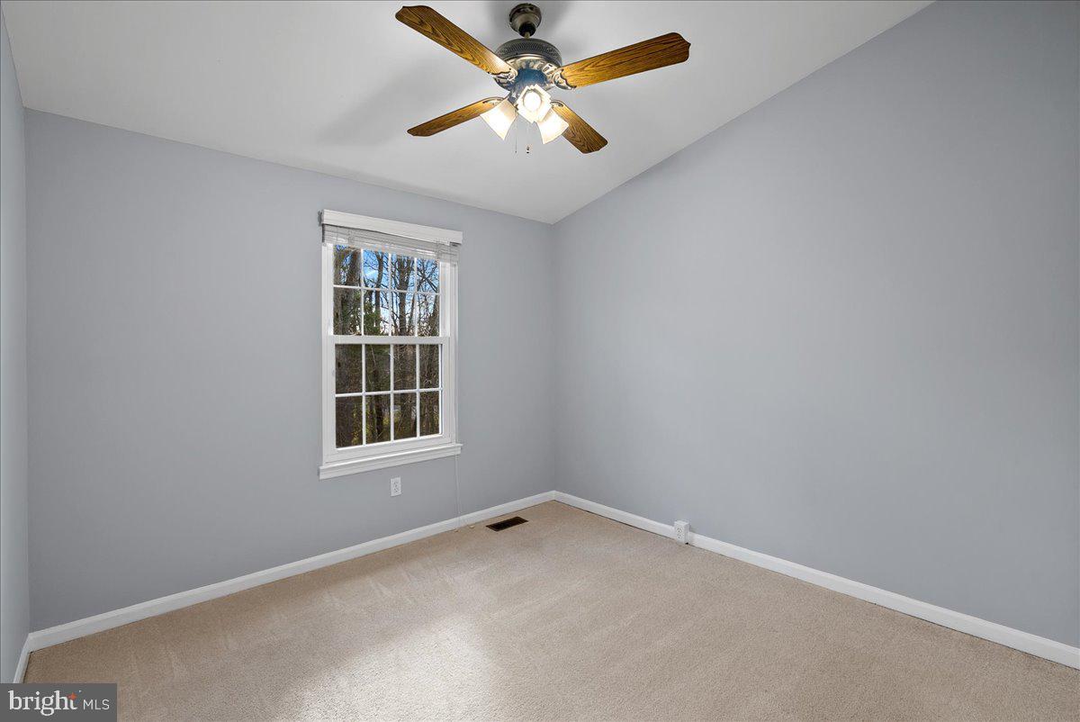 1481 Autumn Ridge Circle Reston, VA 20194 - Photo 17 of 26 an empty room with a window and a fan