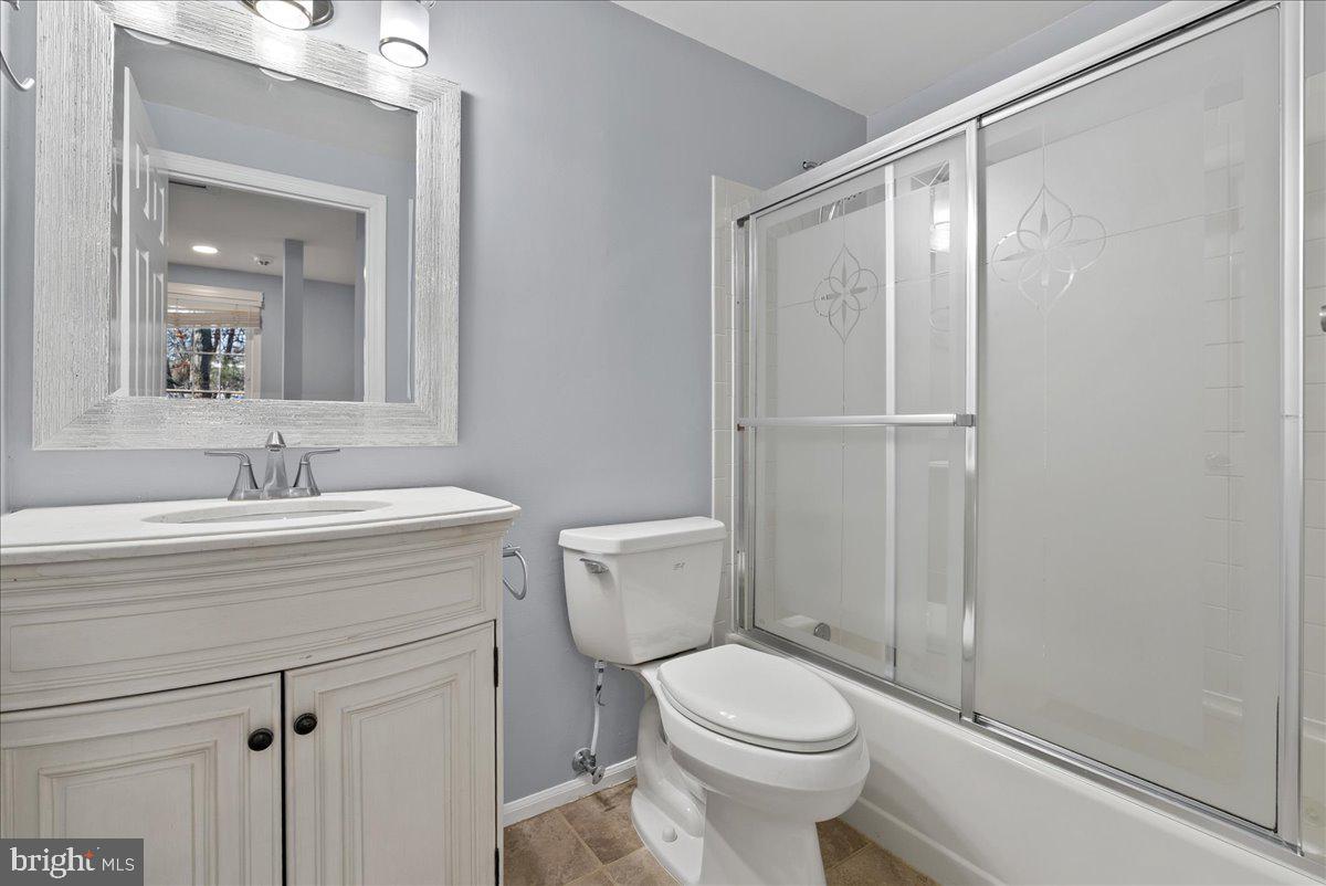 1481 Autumn Ridge Circle Reston, VA 20194 - Photo 19 of 26 a bathroom with a sink a toilet and shower