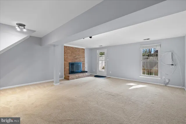 a view of a backyard with wooden fence