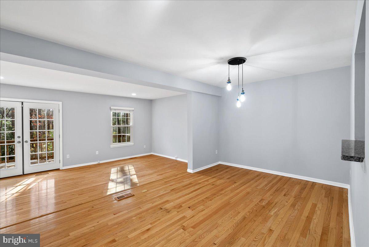 1481 Autumn Ridge Circle Reston, VA 20194 - Photo 8 of 26 a view of empty room with wooden floor and fan