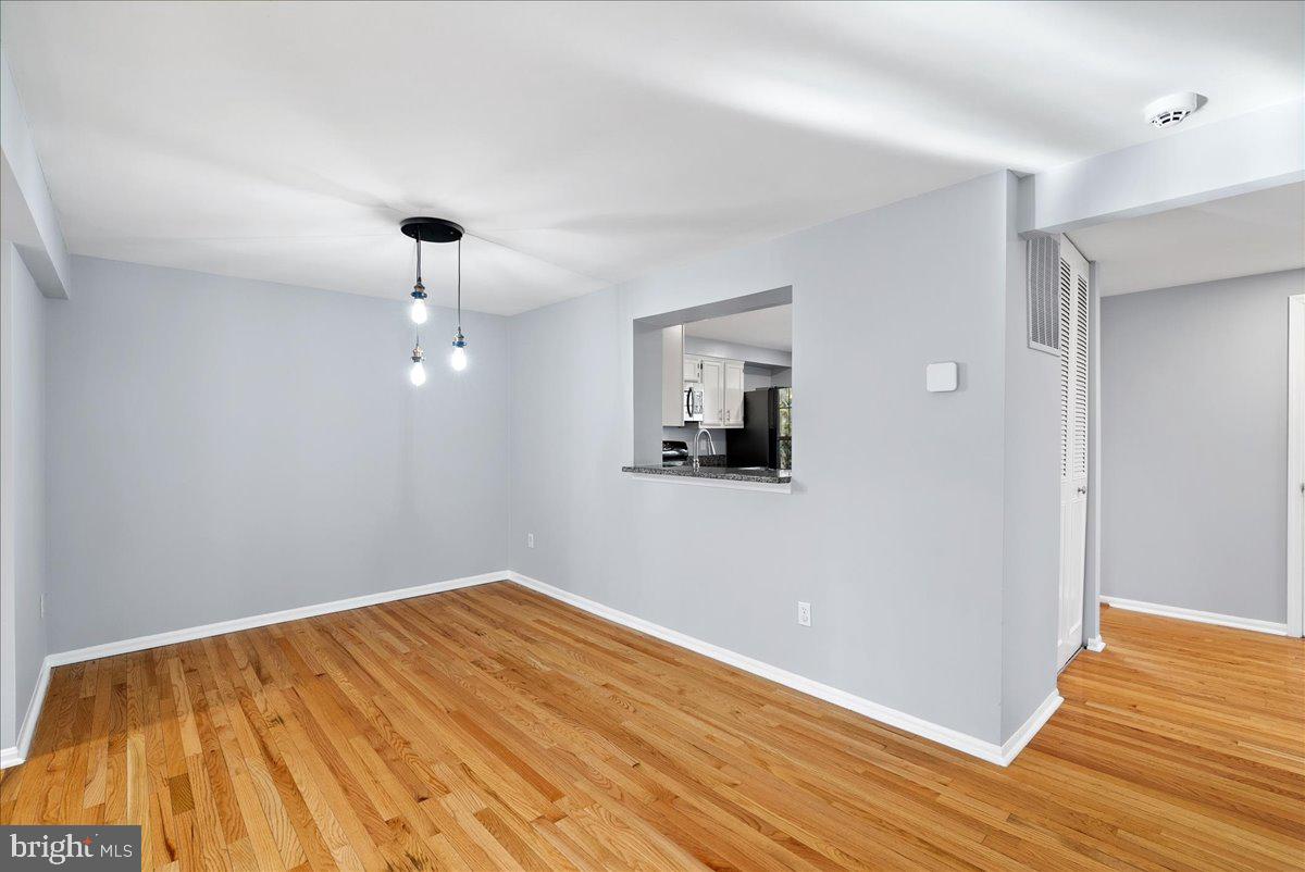 1481 Autumn Ridge Circle Reston, VA 20194 - Photo 9 of 26 a view of empty room with wooden floor