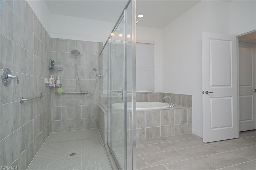 2532 Kona Way Naples, FL 34120 - Photo 12 of 30 a bathroom with a shower