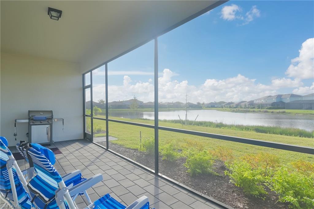 2532 Kona Way Naples, FL 34120 - Photo 20 of 30 a view of an empty room with a floor to ceiling window and floor to ceiling window