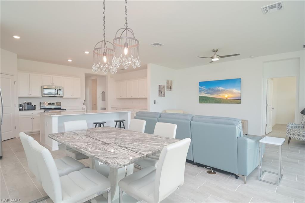 2532 Kona Way Naples, FL 34120 - Photo 2 of 30 a view of a dining room with furniture