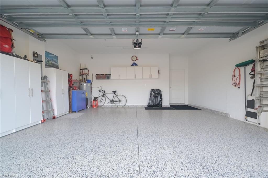 2532 Kona Way Naples, FL 34120 - Photo 21 of 30 a kitchen with refrigerator and cabinets