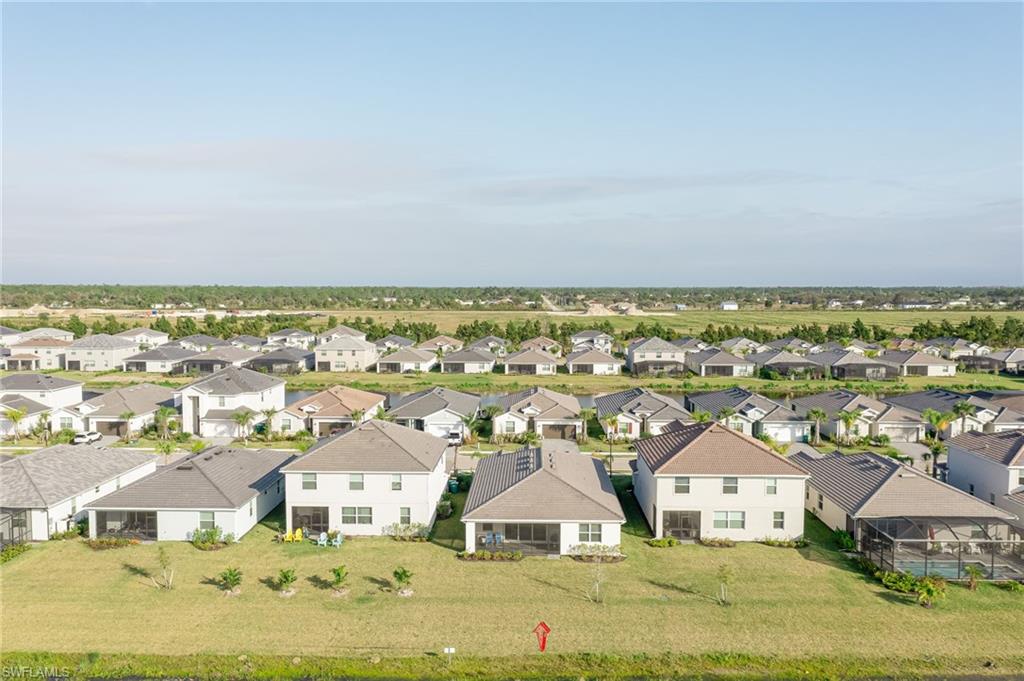 2532 Kona Way Naples, FL 34120 - Photo 23 of 30 an aerial view of residential houses with outdoor space