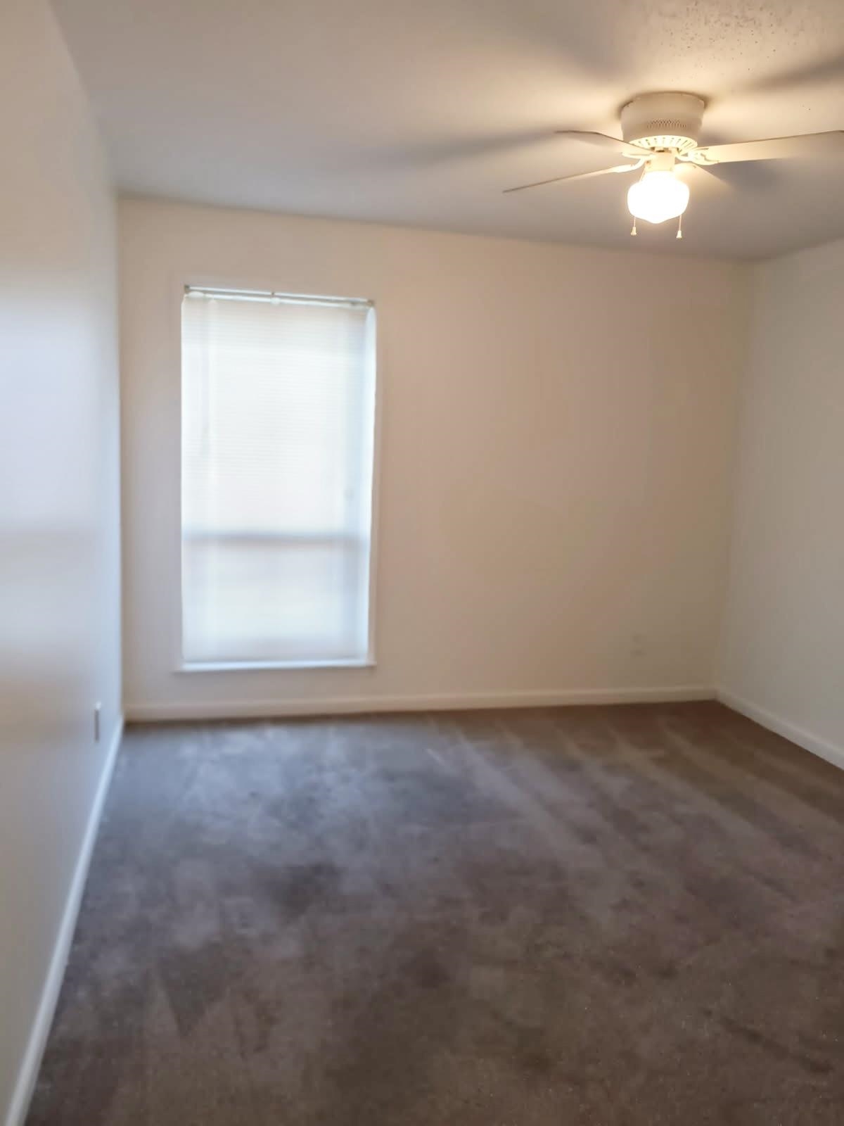 1770 Crompton 6th Square, Unit 29 Memphis, TN 38134 - Photo 15 of 21 Spare room with dark colored carpet and ceiling fan