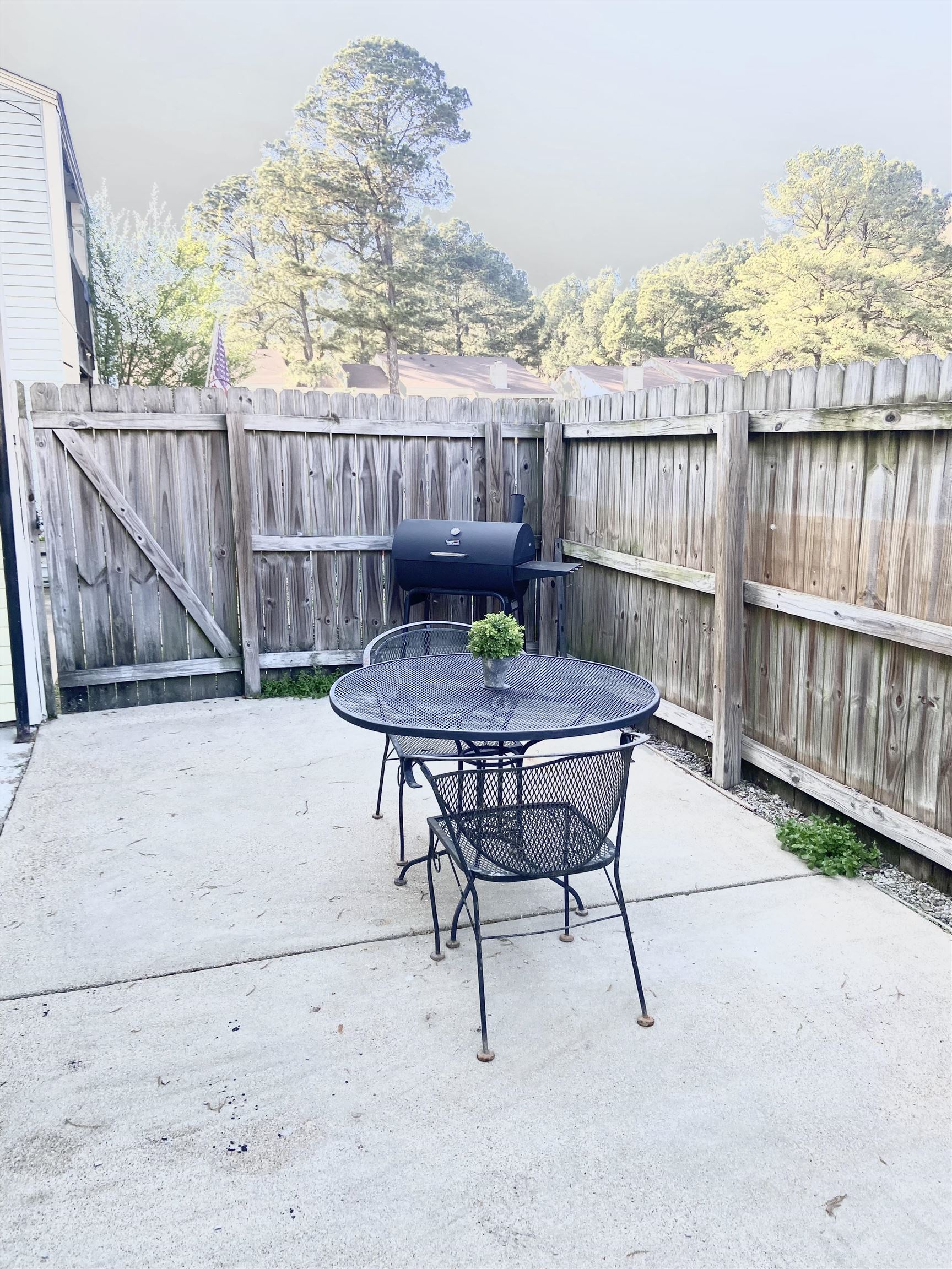 1770 Crompton 6th Square, Unit 29 Memphis, TN 38134 - Photo 19 of 21 Fenced backyard featuring a patio, grilling area, and outdoor dining space