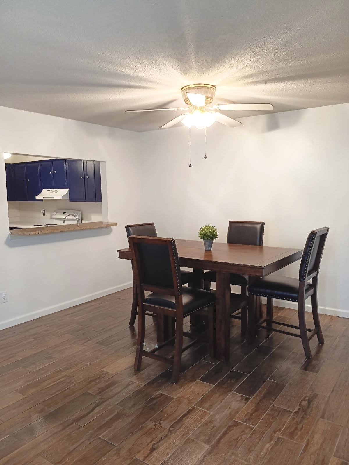 1770 Crompton 6th Square, Unit 29 Memphis, TN 38134 - Photo 6 of 21 Dining space featuring dark wood finished floors, a ceiling fan, and a textured ceiling