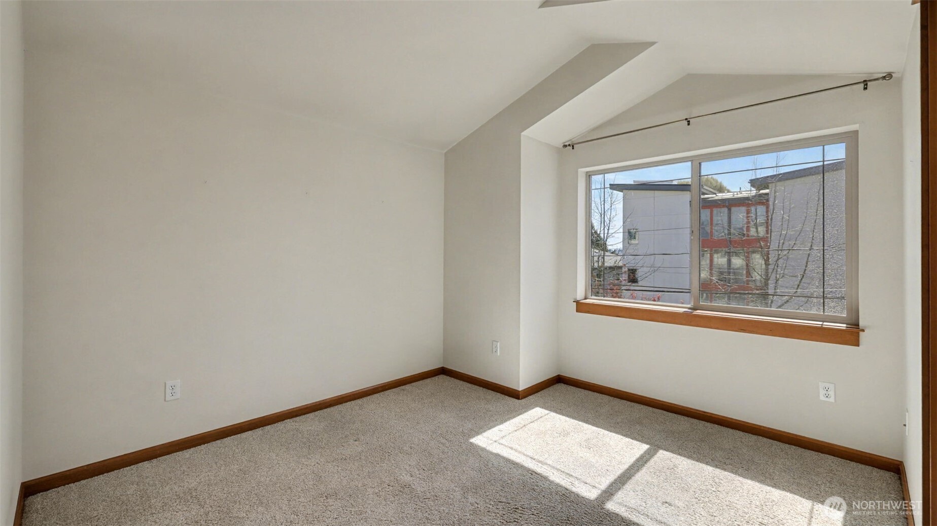 1120 North 92nd Street, Unit A Seattle, WA 98103 - Photo 15 of 22 an empty room with a window