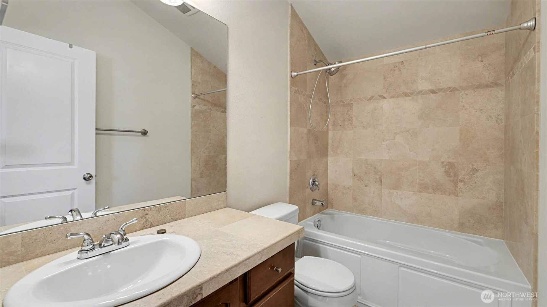 1120 North 92nd Street, Unit A Seattle, WA 98103 - Photo 20 of 22 a bathroom with a sink a toilet and a bathtub