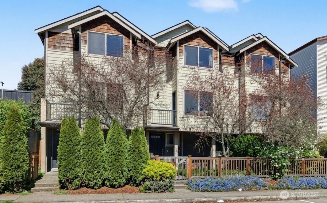 1120 North 92nd Street, Unit A Seattle, WA 98103 - Photo 2 of 22 a front view of a house with garden