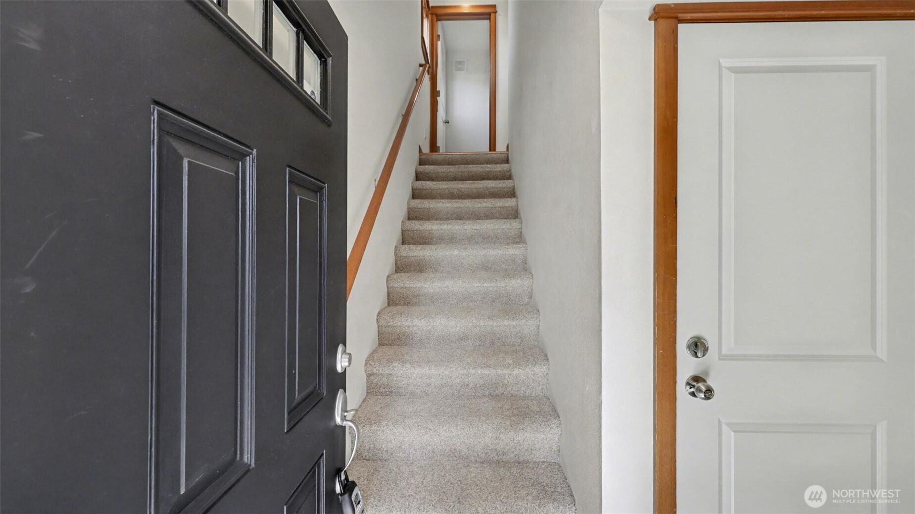 1120 North 92nd Street, Unit A Seattle, WA 98103 - Photo 21 of 22 a view of staircase with white walls and white door