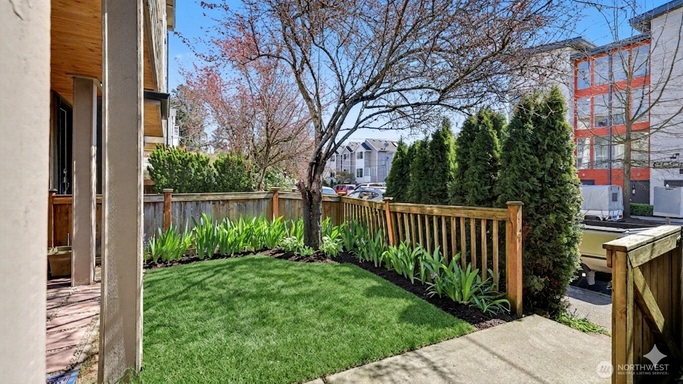 1120 North 92nd Street, Unit A Seattle, WA 98103 - Photo 4 of 22 a view of a backyard with a garden