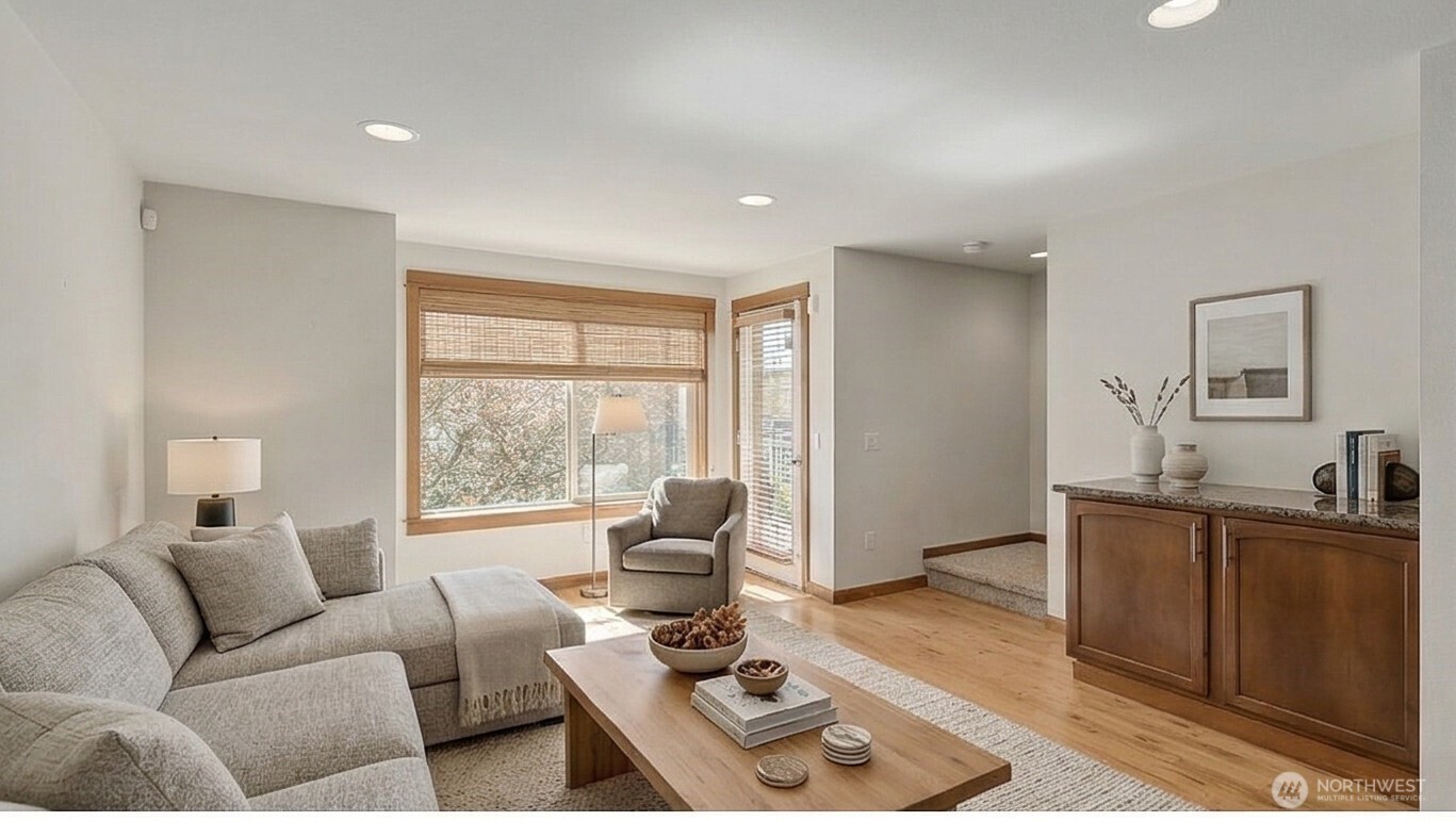 1120 North 92nd Street, Unit A Seattle, WA 98103 - Photo 9 of 22 a living room with furniture and a window