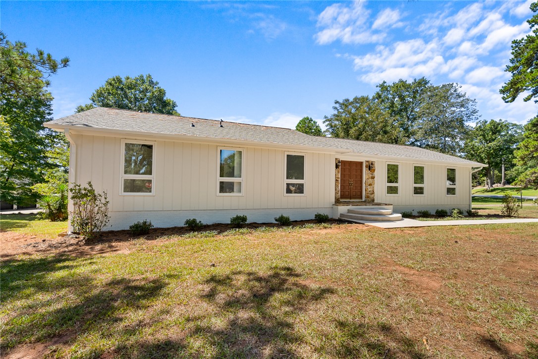 208 Williamsburg Road Anderson, SC 29621 - Photo 3 of 48 Vertical board and batten siding pairs beautifully with classic shingle roofing.