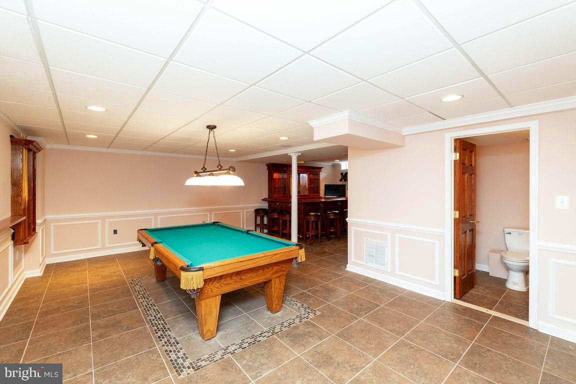 1019 Double Gate Road Davidsonville, MD 21035 - Photo 23 of 50 Game room on lower level. The Pool table conveys