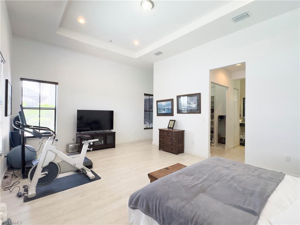 5169 Roma Street South Ave Maria, FL 34142 - Photo 24 of 49 a bedroom with furniture and a flat screen tv
