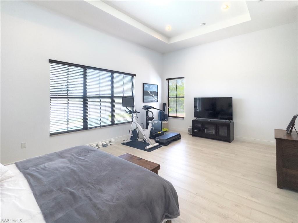 5169 Roma Street South Ave Maria, FL 34142 - Photo 25 of 49 a bed room with television and a bed