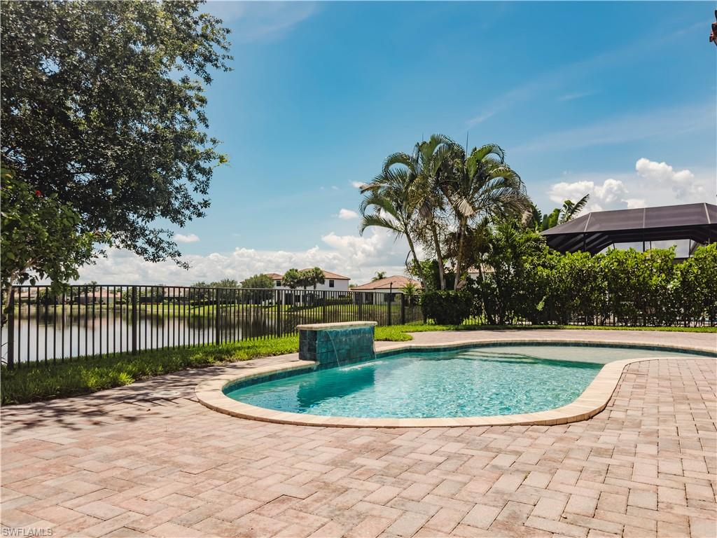5169 Roma Street South Ave Maria, FL 34142 - Photo 3 of 49 a view of a swimming pool with a yard