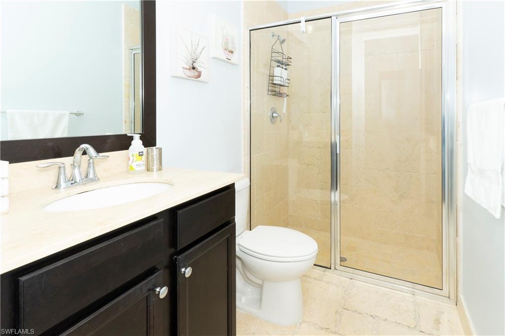 5169 Roma Street South Ave Maria, FL 34142 - Photo 31 of 49 a bathroom with a sink a toilet and shower