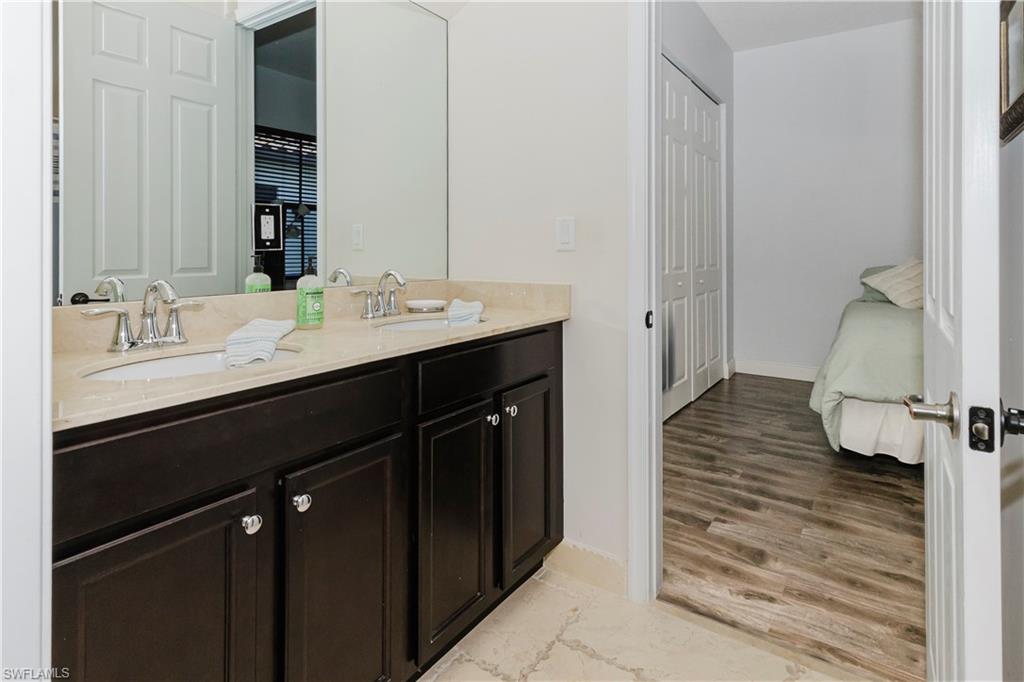 5169 Roma Street South Ave Maria, FL 34142 - Photo 35 of 49 a en suite bathroom with a sink and a mirror