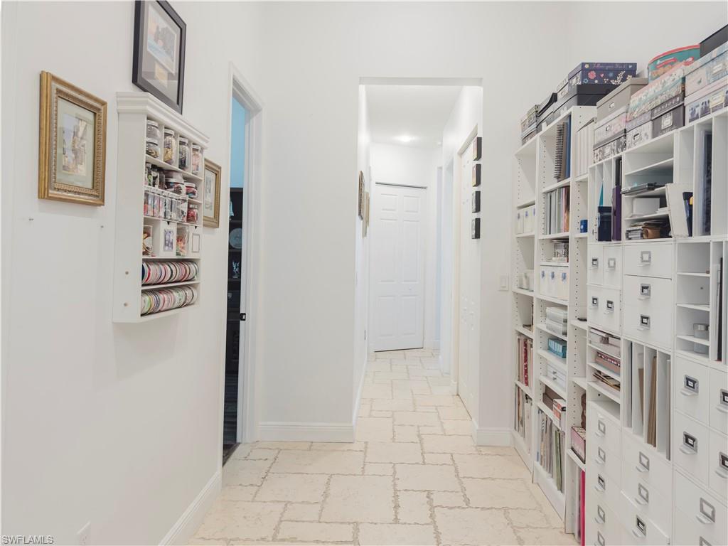 5169 Roma Street South Ave Maria, FL 34142 - Photo 37 of 49 a view of a bathroom with a walk in closet and wooden floor