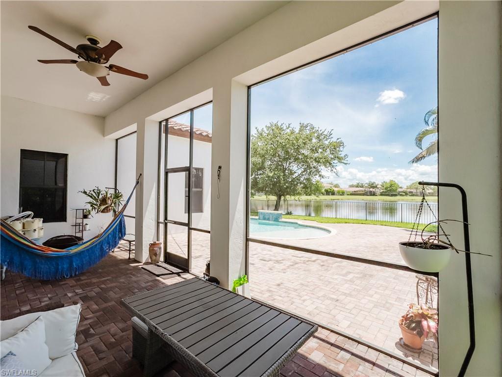 5169 Roma Street South Ave Maria, FL 34142 - Photo 42 of 49 a living room with furniture and a large window