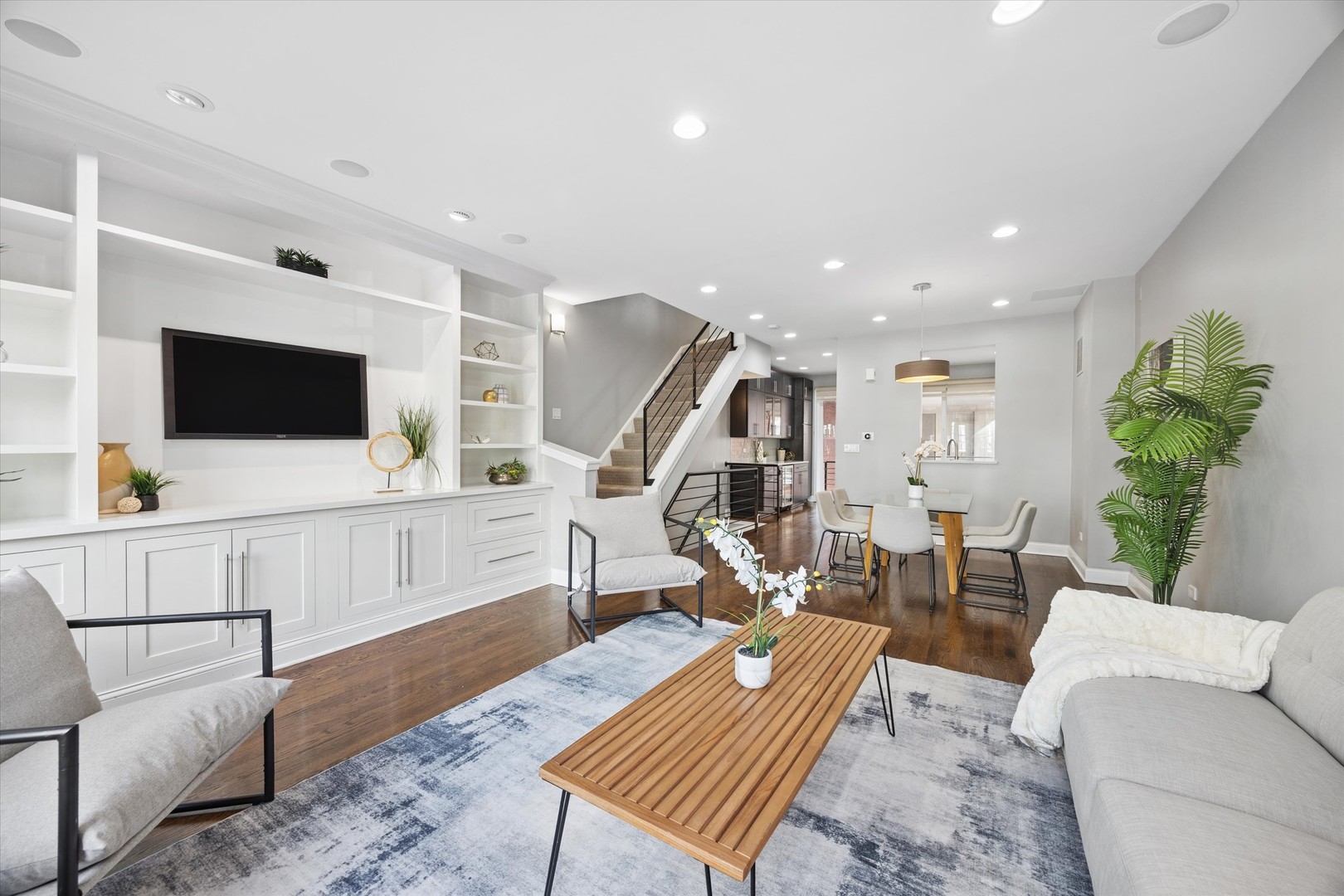 1229 West Madison Street, Unit A Chicago, IL 60607 - Photo 4 of 29 a living room with furniture and a flat screen tv