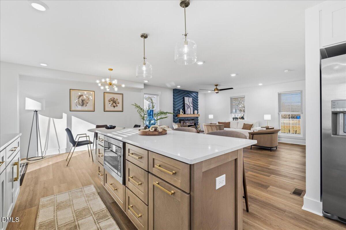 617 North 3rd Street Mebane, NC 27302 - Photo 22 of 50 a large kitchen with a table and chairs