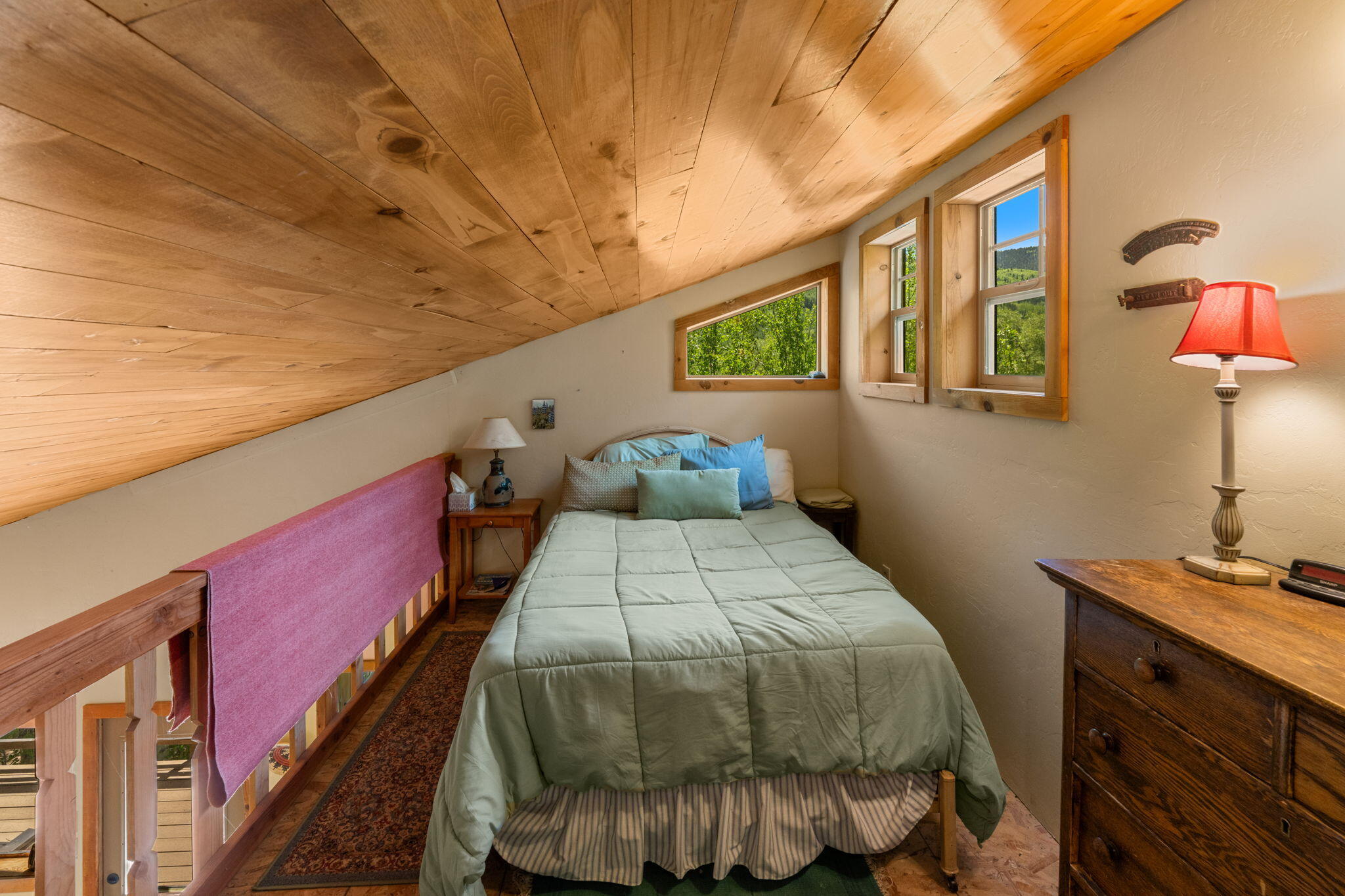 313 North Piedmont Street Rico, CO 81332 - Photo 42 of 43 a bedroom with a bed and wooden floor
