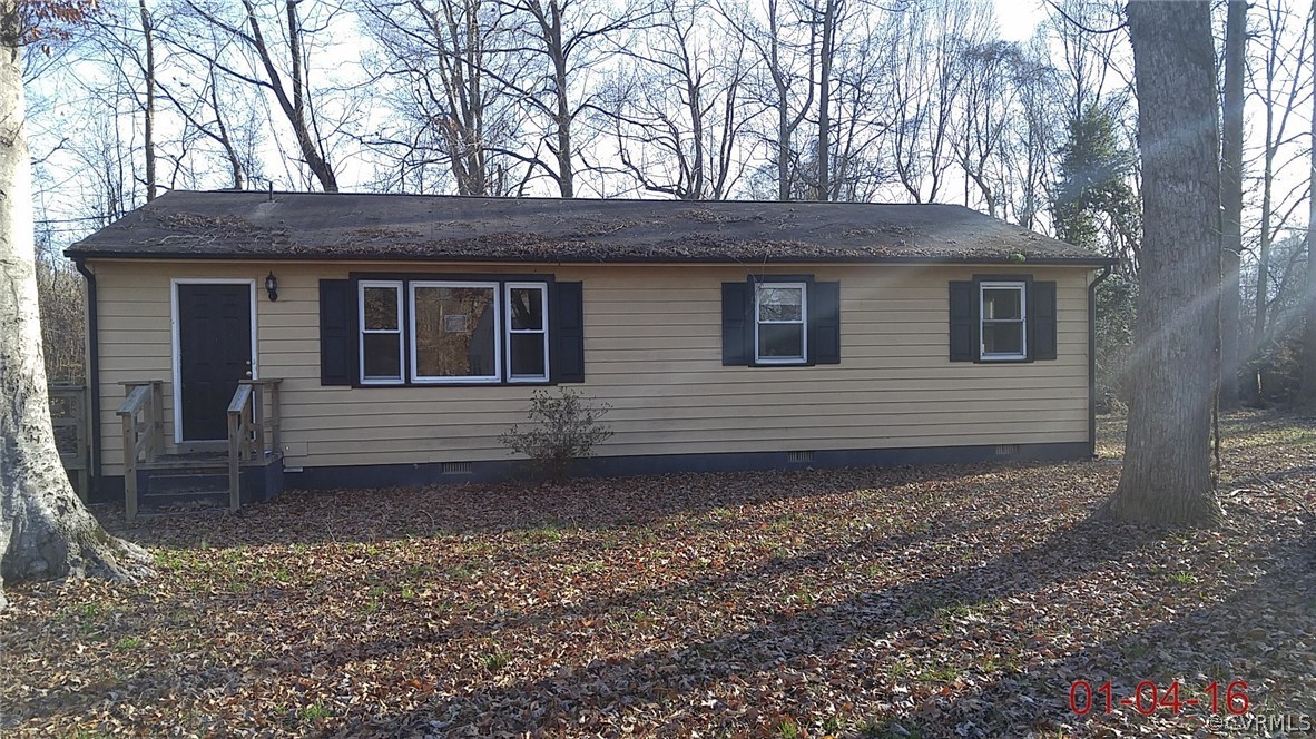 6731 Cherry Road Quinton, VA 23141 - Photo 1 of 13 a view of a house with a yard