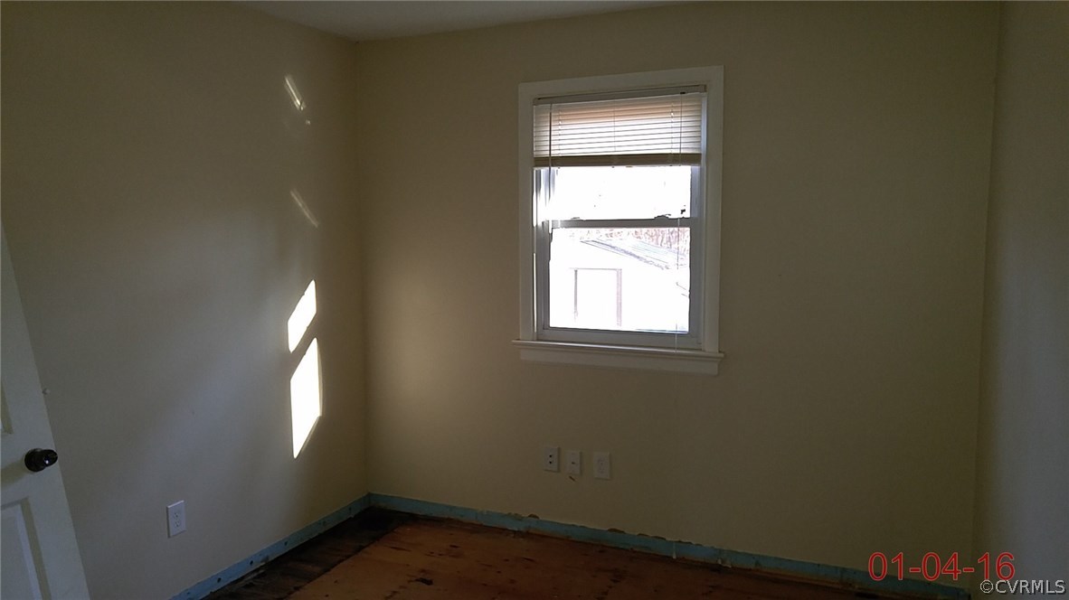 6731 Cherry Road Quinton, VA 23141 - Photo 12 of 13 an empty room with a window
