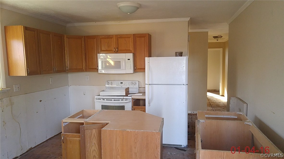 6731 Cherry Road Quinton, VA 23141 - Photo 4 of 13 a kitchen with a refrigerator a stove top oven and a cabinets