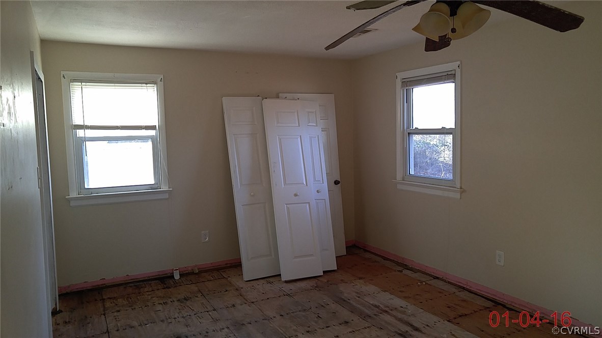 6731 Cherry Road Quinton, VA 23141 - Photo 8 of 13 an empty room with windows