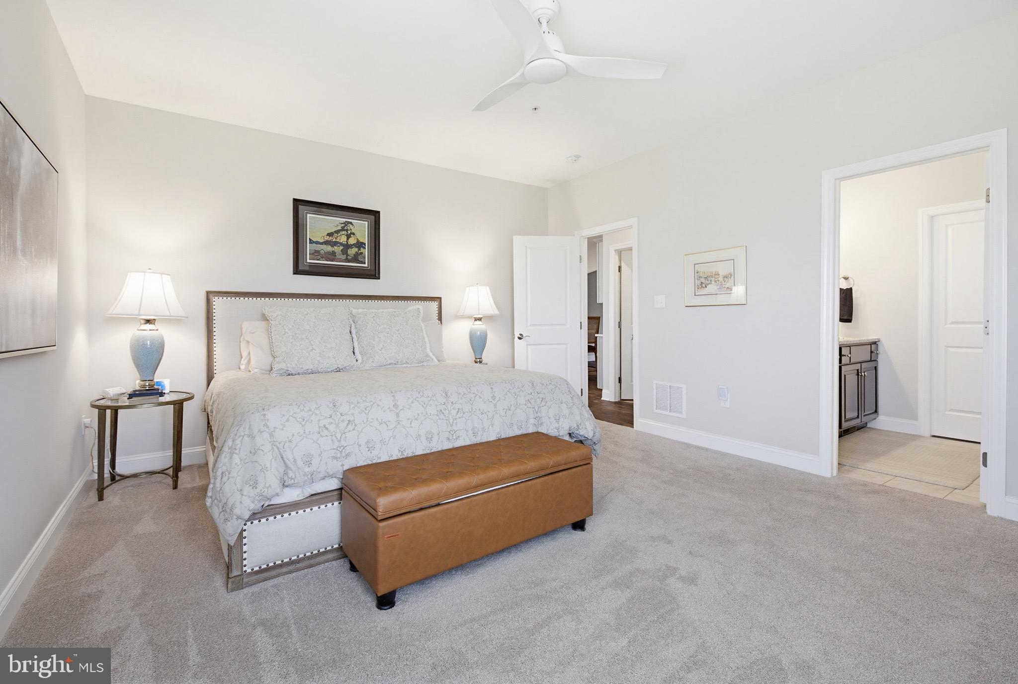361 Meadow Rose Drive Lititz, PA 17543 - Photo 20 of 39 a bedroom with a bed and a lamp