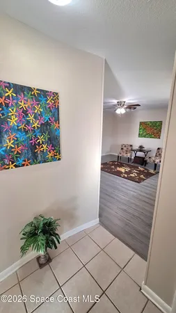 a room with a cabinet and a potted plant