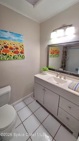 a bathroom with a sink a toilet and a shower