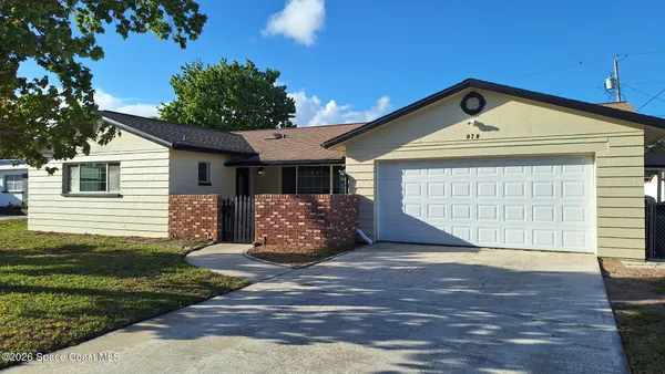 a front view of a house with a garage
