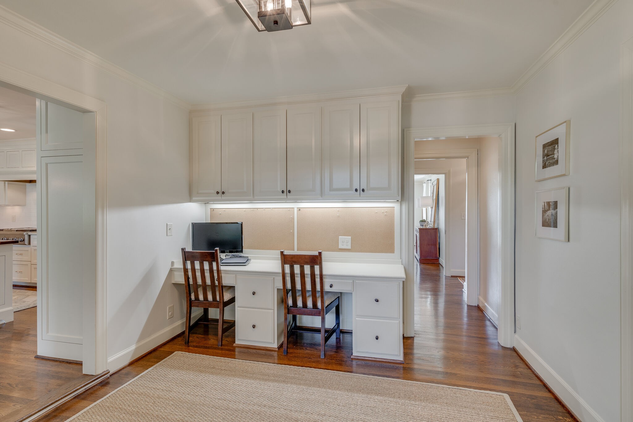 4321 Sneed Road Nashville, TN 37215 - Photo 16 of 37 a kitchen with stainless steel appliances a refrigerator and wooden floor