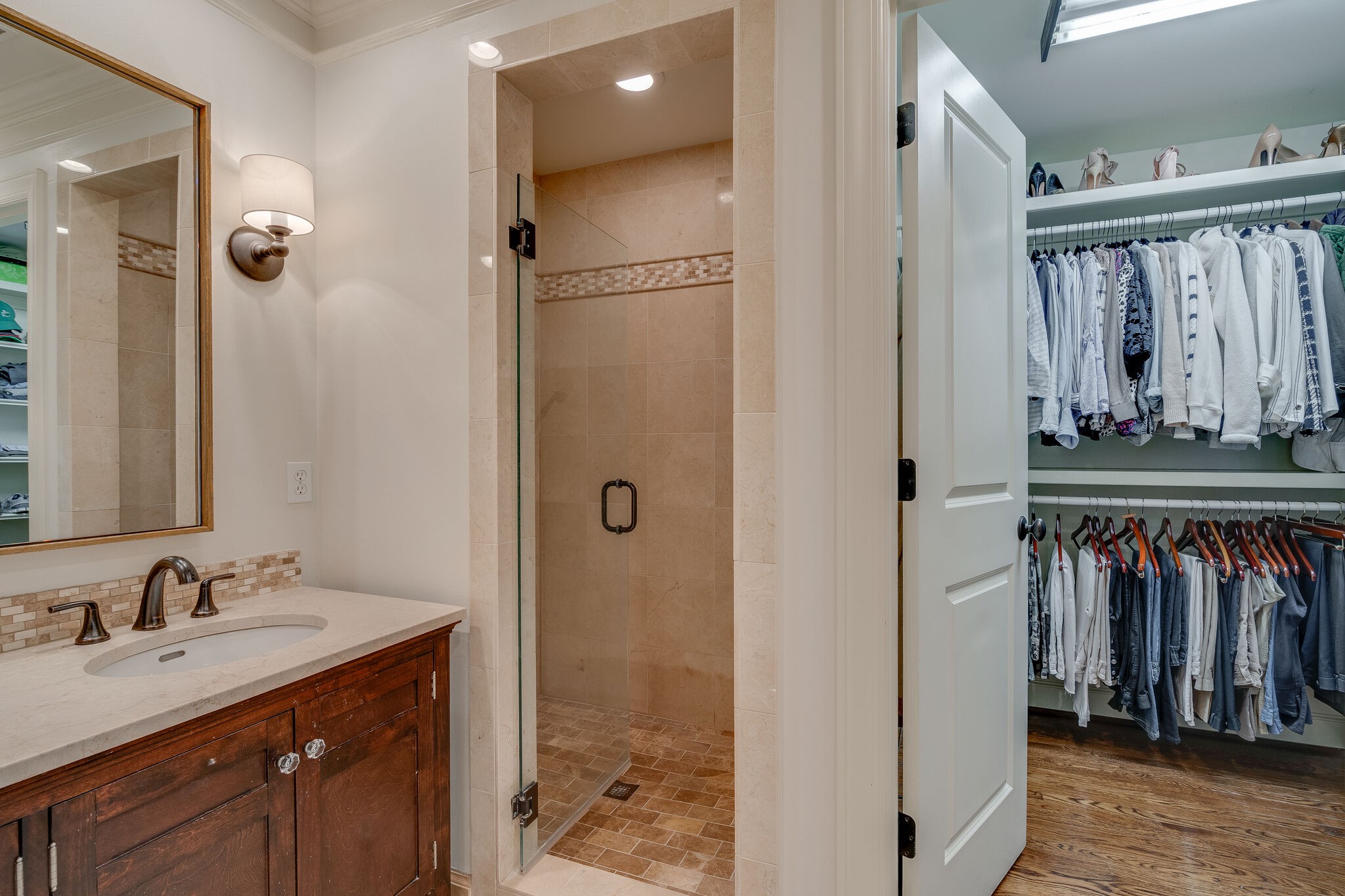 4321 Sneed Road Nashville, TN 37215 - Photo 21 of 37 a bathroom with a sink a mirror and a shower