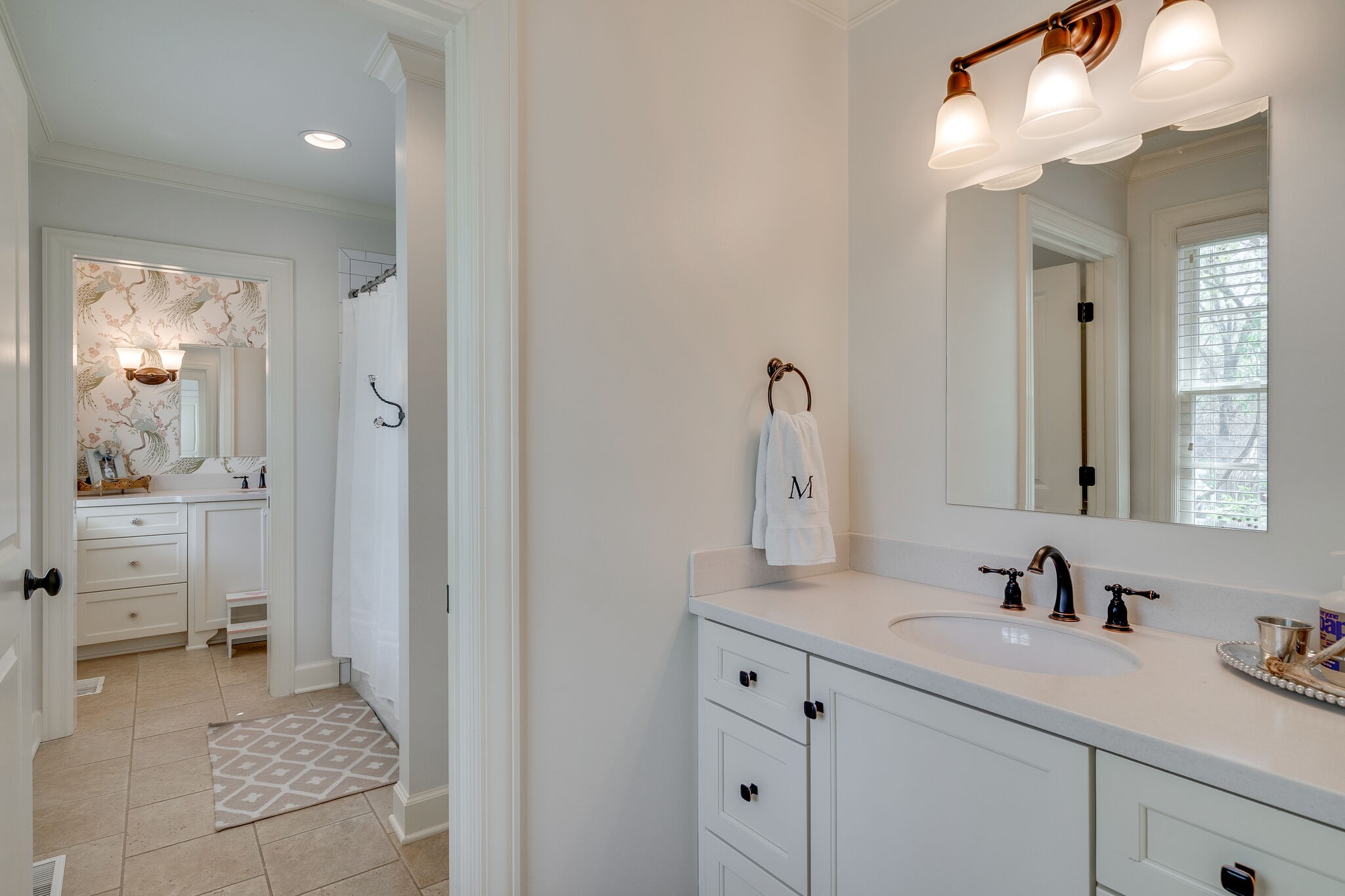 4321 Sneed Road Nashville, TN 37215 - Photo 24 of 37 a en suite bathroom with a sink double vanity and a mirror