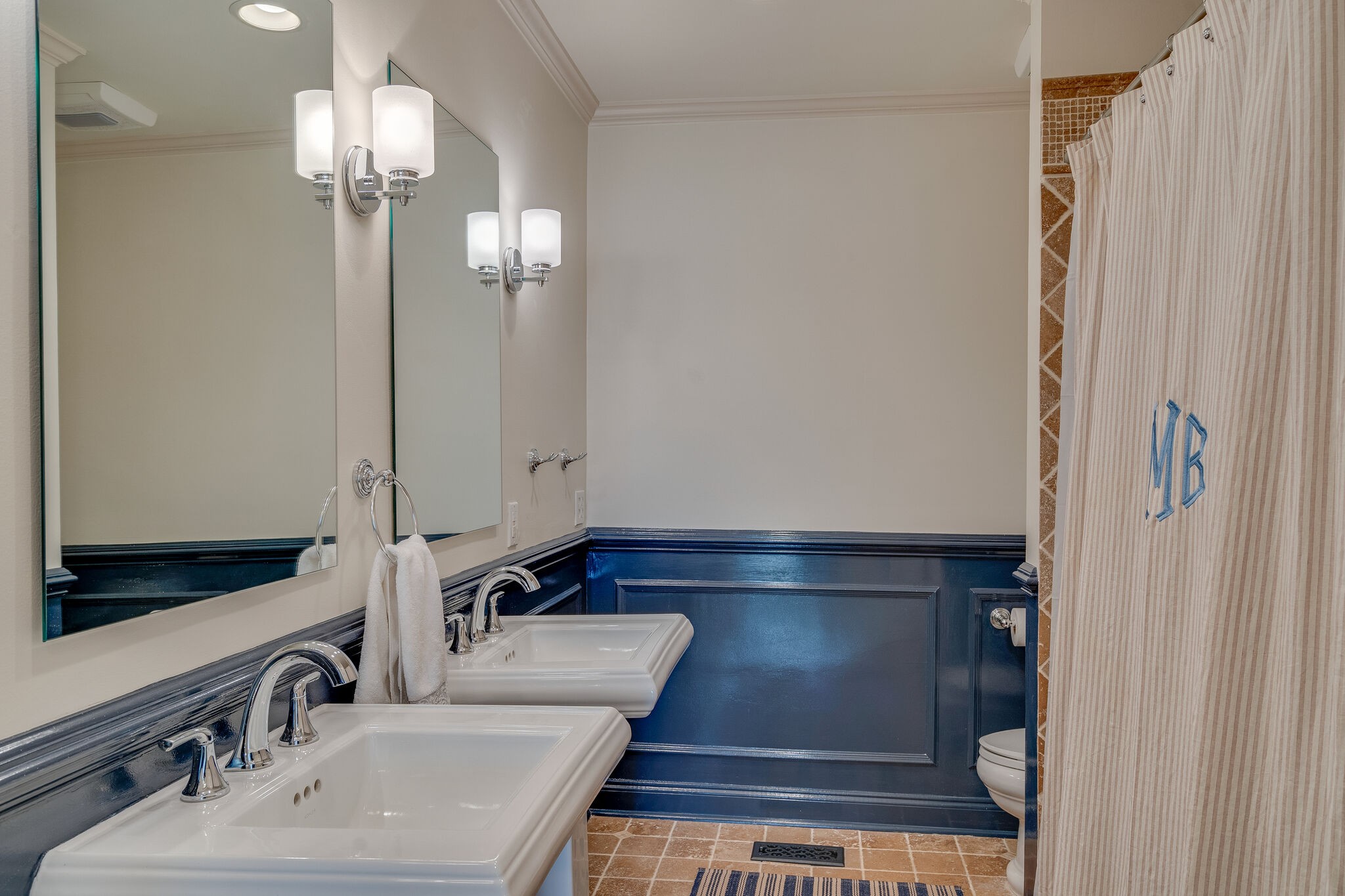 4321 Sneed Road Nashville, TN 37215 - Photo 27 of 37 a bathroom with a sink and a mirror