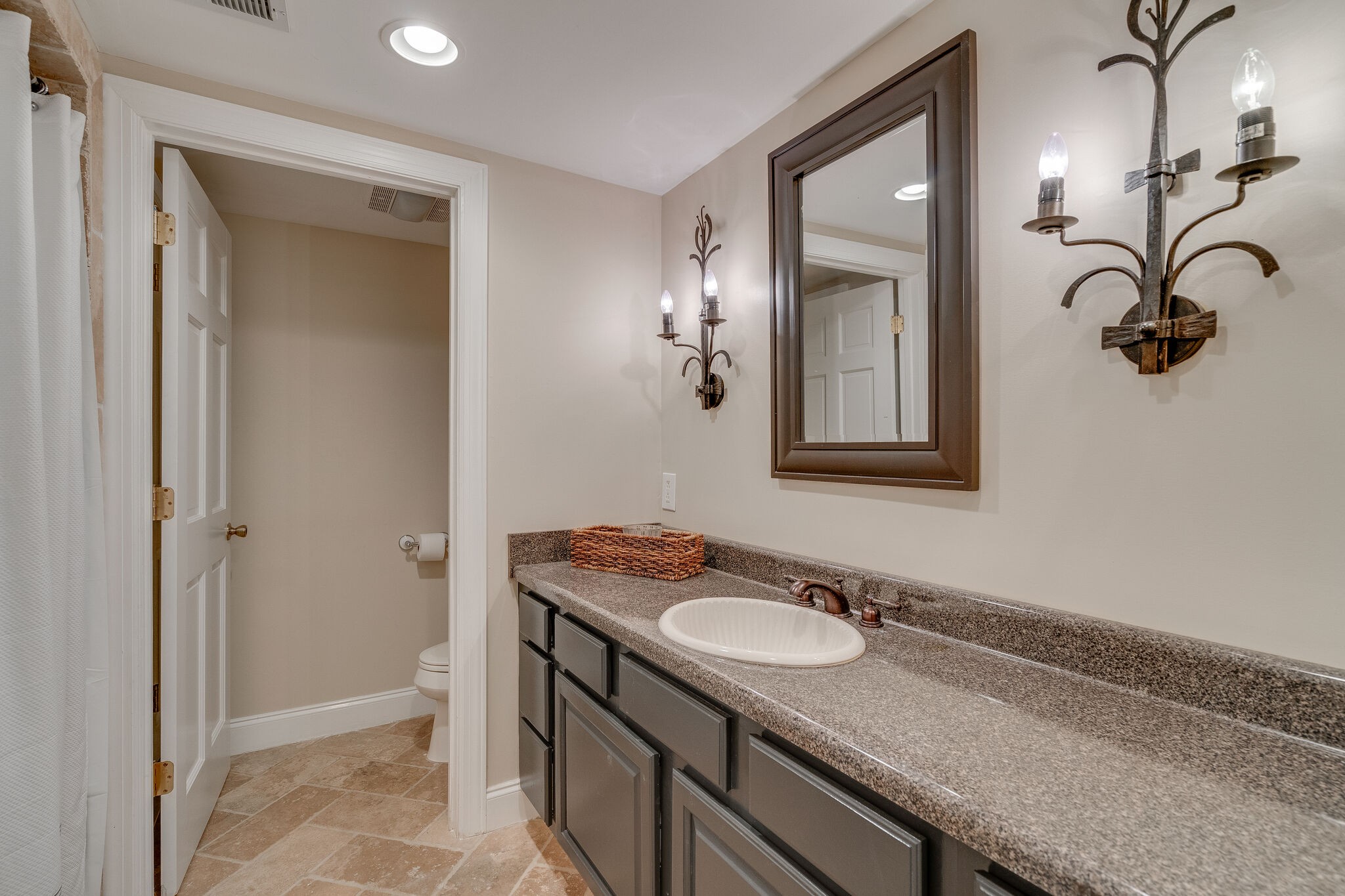 4321 Sneed Road Nashville, TN 37215 - Photo 29 of 37 a bathroom with a granite countertop sink and a mirror