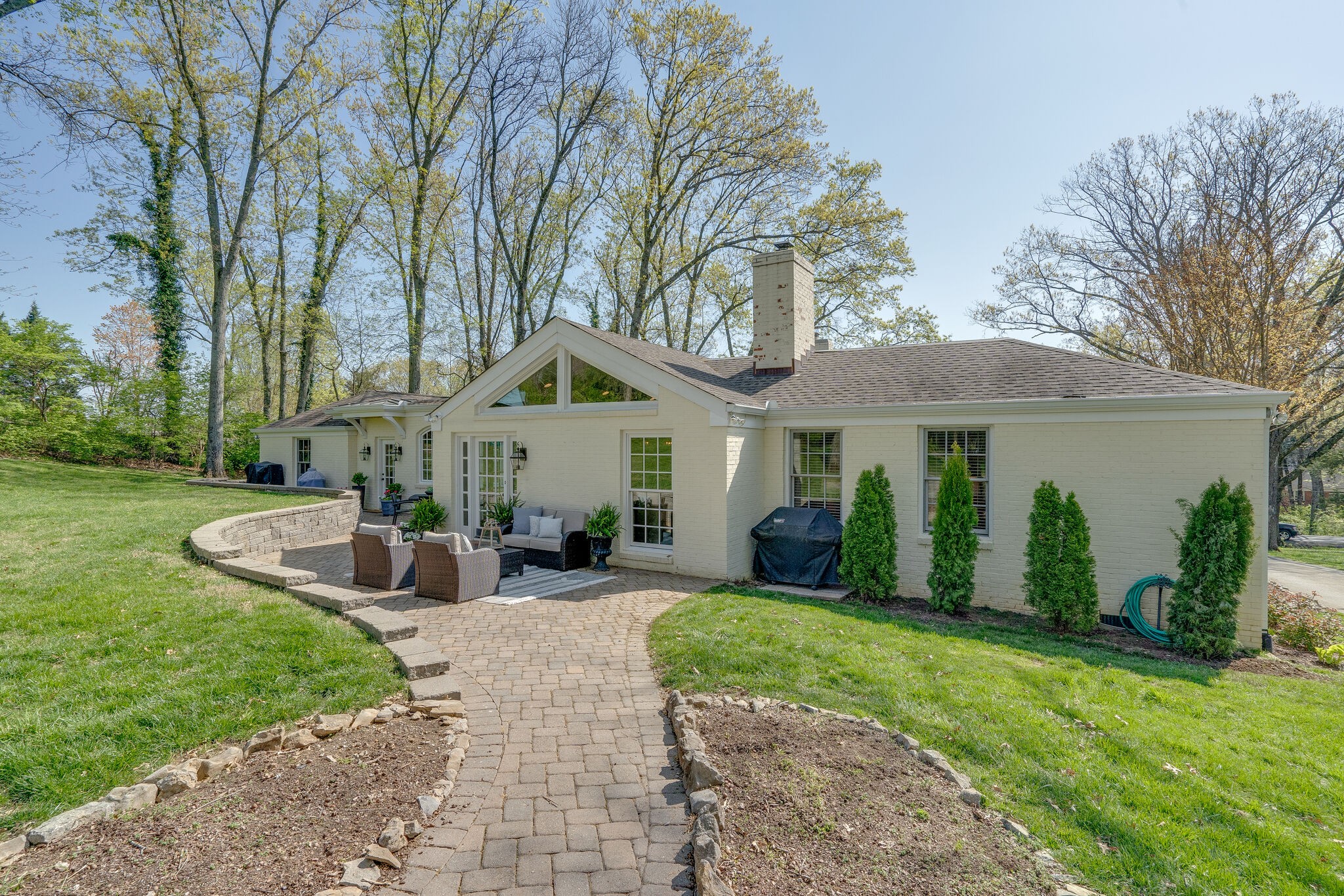 4321 Sneed Road Nashville, TN 37215 - Photo 35 of 37 a front view of a house with garden and porch