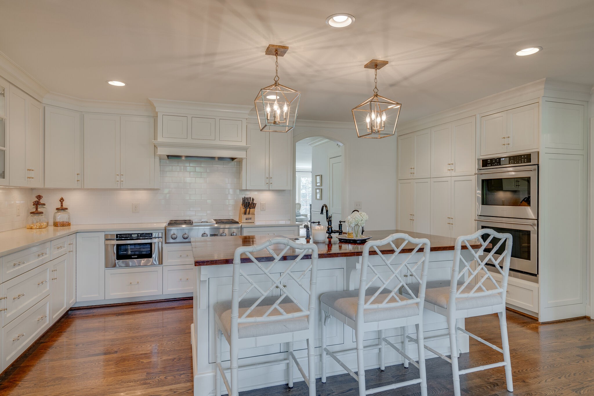 4321 Sneed Road Nashville, TN 37215 - Photo 9 of 37 a kitchen with stainless steel appliances kitchen island granite countertop a dining table chairs and granite counter tops