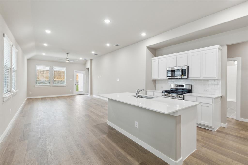 8356 Kingfisher Road Pilot Point, TX 76258 - Photo 11 of 32 Open living space in in the Elm home plan by Trophy Signature Homes – REPRESENTATIVE PHOTO
